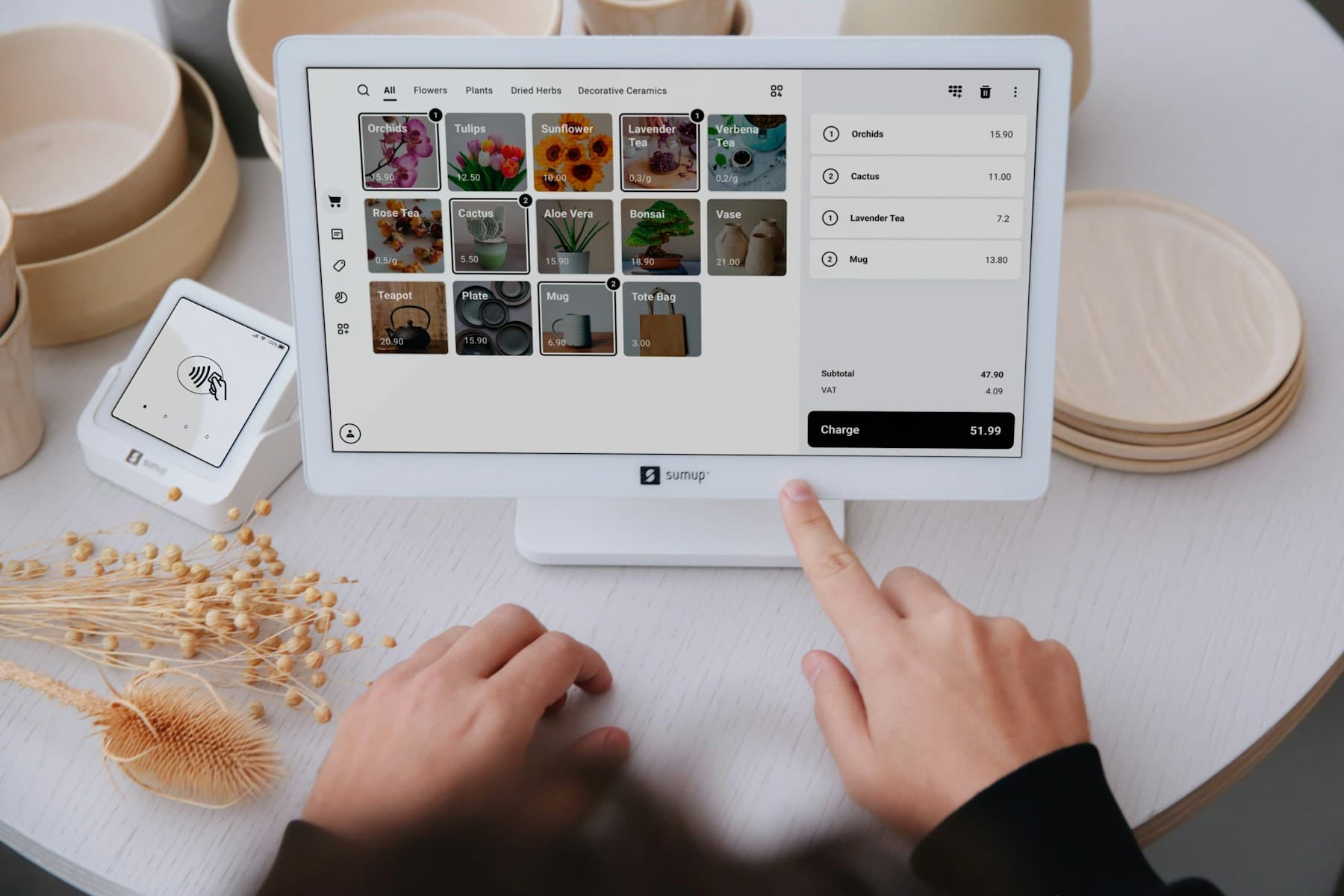 A retail point-of-sale terminal being used at a checkout counter